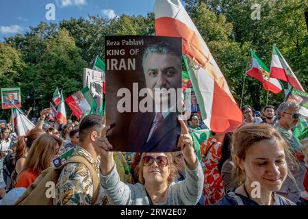 Berlin, Germany. 16th Sep, 2023. The area surrounding Berlin's iconic Victory Column was a sea of protesters on September 16, 2023; many held aloft images of Reza Pahlavi, the Crown Prince of Iran. The gathering marked the first anniversary of the tragic death of Mahsa Amini, a 22-year-old Iranian woman who died in the custody of Iran's morality police. Reza Pahlavi, the exiled son of Iran's last shah, has been a vocal critic of the Iranian regime. (Credit Image: © Michael Kuenne/PRESSCOV via ZUMA Press Wire) EDITORIAL USAGE ONLY! Not for Commercial USAGE! Stock Photo