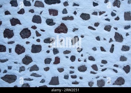 Volcanic rocks embedded in a wall. Traditional architecture of the Canary Islands Stock Photo
