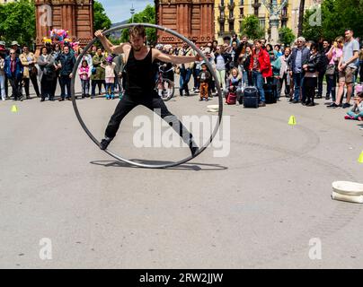 Barcelona, Catalonia Spain, May 01 2017 - Street performer entertaining crowds in Barcelona in front of the Arc de Triomf Stock Photo