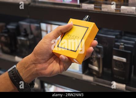 Bangkok, Thailand - September 2, 2023: a hand holds a Gucci Bloom Profumo di Fiori. Stock Photo