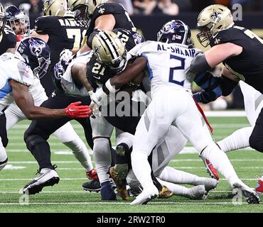 New Orleans, USA. 10th Sep, 2023. Tennessee Titans linebacker Azeez Al-Shaair (2) tackles New Orleans Saints running back Jamaal Williams (21) during a National Football League game at Caesars Superdome in New Orleans, Louisiana on Sunday, September 10, 2023. (Photo by Peter G. Forest/Sipa USA) Credit: Sipa USA/Alamy Live News Stock Photo