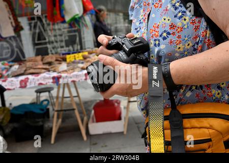 Woman with Nikon Z digital camera Stock Photo