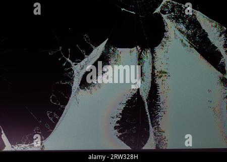 broken lcd tft tn screen flat macro texture with crystal leakage and physical damage cracks, closeup with selective focus and blur. Stock Photo