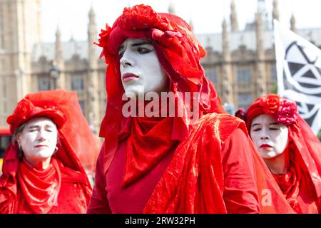 London, UK. 16th Sep, 2023. Extinction Rebellion in Parliament Square, London, join an international protest against fossil fuels. The British protests focus on UK issues such as the Rosebank coalmine and calling on the Conservative government not to issue any new oil drilling licenses. The Red Rebels led the peaceful march from Victoria to Parliament. Credit: Anna Watson/Alamy Live News Stock Photo