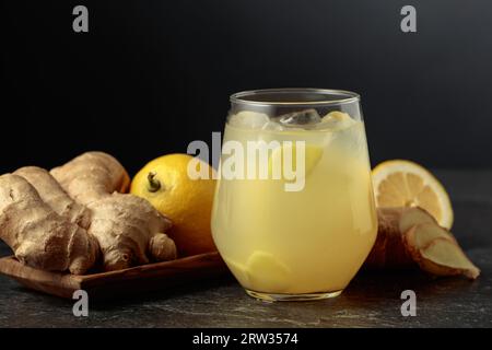 Ginger Ale with ice and lemon. Homemade lemon and ginger organic probiotic drink. Copy space. Stock Photo