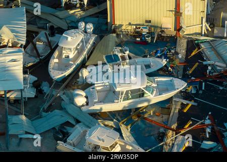 Hurricane Ian destroyed boat station in Florida coastal area. Natural disaster and its consequences Stock Photo