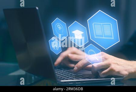 E-learning and Online Education concept. Male student learning lesson process holding hands on computer keyboard. Stock Photo