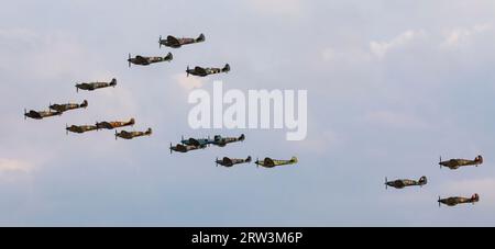 Duxford, Cambridgeshire, UK. 16th Sep 2023. An incredible mass formation of Spitfires and Hurricanes, one of the largest ever at IWM Duxford, in commemoration of the Battle of Britain. Credit: Stuart Robertson/Alamy Live News. Stock Photo