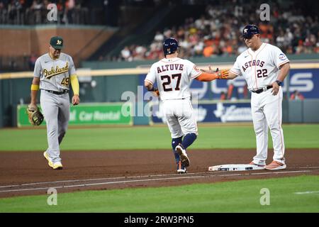 Houston Astros first base coach Jose Cruz checks his hair as he comes off  the field in the third inning against the St. Louis Cardinals at Busch  Stadium in St. Louis on