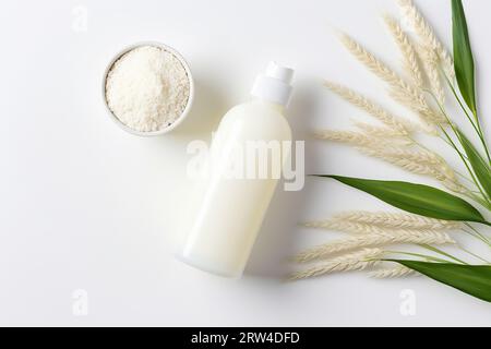 Cosmetic skin care product face cream or mask on background of rice or oatmeal Stock Photo