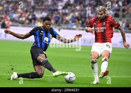 Milan, Italy. 16th Sep, 2023. Inter Milan's Denzel Dumfries (L) vies with AC Milan's Theo Hernandez during their Serie A football match in Milan, Italy, on Sept. 16, 2023. Credit: Alberto Lingria/Xinhua/Alamy Live News Stock Photo