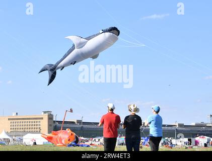 Berlin, Germany. 16th Sep, 2023. People fly kites during the Giant Kite Festival in Berlin, Germany, Sept. 16, 2023. Credit: Ren Pengfei/Xinhua/Alamy Live News Stock Photo