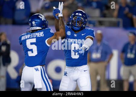 Kentucky running back Demie Sumo-Karngbaye (0) and quarterback Kaiya Sheron  (12) celebrate after a touchdown during the second half of an NCAA college  football game against Akron in Lexington, Ky., Saturday, Sept.