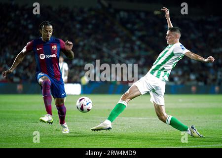 Barcelona, Spain. 16th Sep, 2023. Jules Kounde (L) of Barcelona vies with Sergi Altimira of Real Betis during their Spanish La Liga football match in Barcelona, Spain, Sept. 16, 2023. Credit: Joan Gosa/Xinhua/Alamy Live News Stock Photo