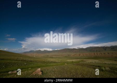 Night landscape of mountains and fields, Tien Shan, Kyrgyzstan Stock Photo