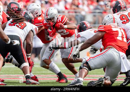 Columbus, Ohio, USA. 16th Sep, 2023. Ohio State Buckeyes running back TreVeyon Henderson (32) carries the ball in traffic during the game between the Western Kentucky Hilltoppers and the Ohio State Buckeyes at Ohio Stadium, Columbus, Ohio. (Credit Image: © Scott Stuart/ZUMA Press Wire) EDITORIAL USAGE ONLY! Not for Commercial USAGE! Stock Photo