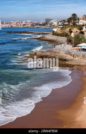Beach and promenade along the Atlantic Ocean coast in resort towns of Estoril and Cascais in Portugal Stock Photo