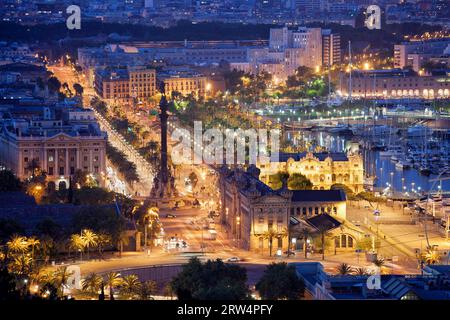 Night in the city of Barcelona in Catalonia, Spain. Columbus Monument and boulevard along Port Vell Stock Photo