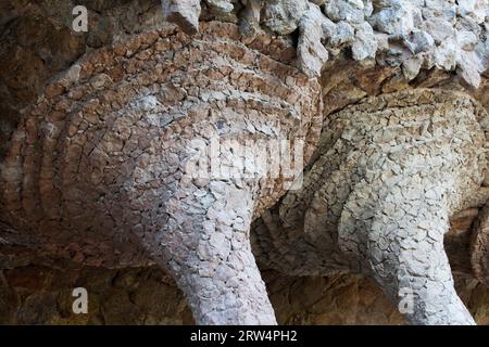 Architectural details in Park Guell by Antoni Gaudi in Barcelona, Catalonia, Spain, closeup on the top part of columns Stock Photo