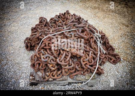 Pile of an old, long, vintage, rusty metal chain with large links Stock Photo