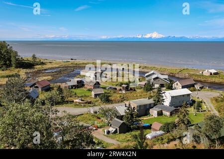 Aerial view of Ninilchik a small Alaskan Native village with Cook Inlet and Aleutian volcanoes in th Stock Photo