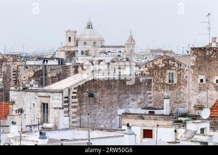 Roofs, view of roofscape, in the back the church Chiesa del Carmine, Martina Franca, Valle d?Itria, Trullo Valley, Puglia, Italy Stock Photo