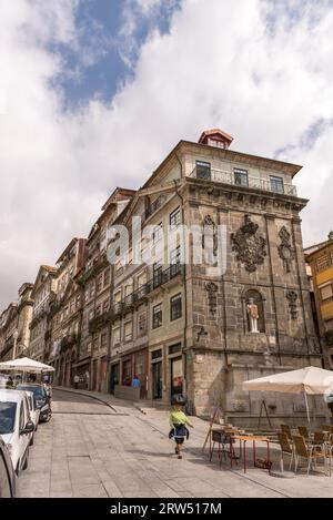 Porto, Portugal, April 26, 2014: View of facades, alleyway and traditional houses in Ribeira old and historic town and alongside Douro River, Porto Stock Photo