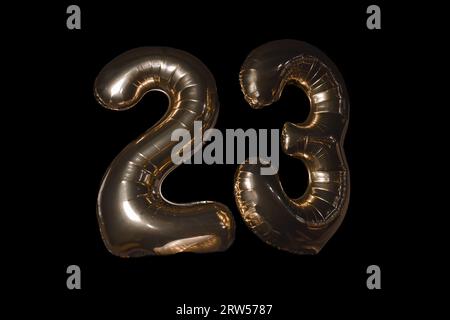 Number 2 two and 3 three 23 twenty-three digits inflated from a balloon air object on a black background. Stock Photo