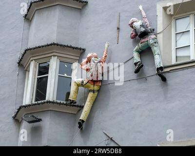 climber on building mannequin puppet detail Stock Photo