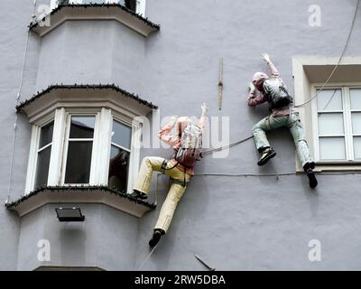 climber on building mannequin puppet detail Stock Photo