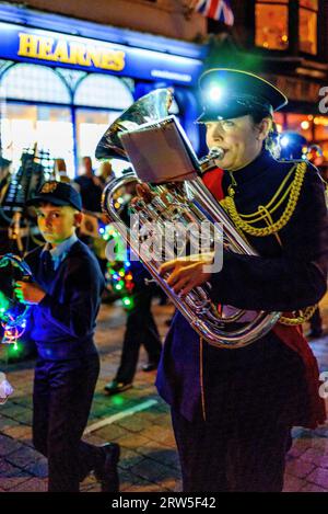 Horn player in a marching band at night, Ringwood Carnival, Hampshire, UK, 16th September 2023. Stock Photo