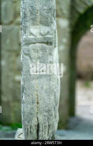 carved head in low relief with protruding ears, Kilfenora Medieval Cathedral (Saint Fachtnanrsquo), Doorty Cross, The Burren, County Clare, Ireland, U Stock Photo