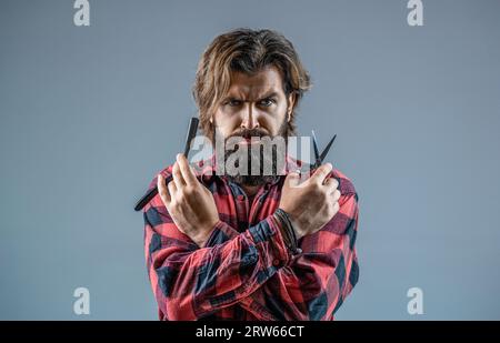Bearded man, bearded male. Portrait of stylish man beard. Barber scissors and straight razor, barber shop. Vintage barbershop, shaving Stock Photo