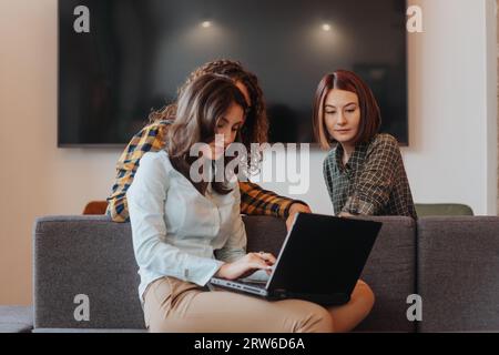 Group of software developers working as team at the office Stock Photo