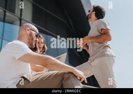 Adult business partners discussing trends, new projects, and profit growth. E-commerce professionals working together online for small business succes Stock Photo