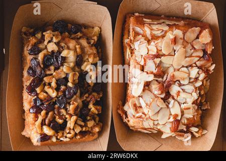 Raisin walnut cinnamon roll and almond cinnamon roll close up, flat lay Stock Photo