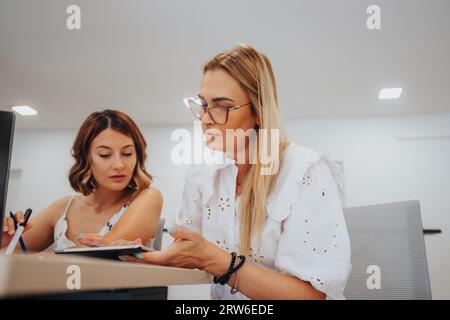 Confident business people analyzing reports, using data analysis for future success. Efficient team working on profit growth and solving problems in a Stock Photo