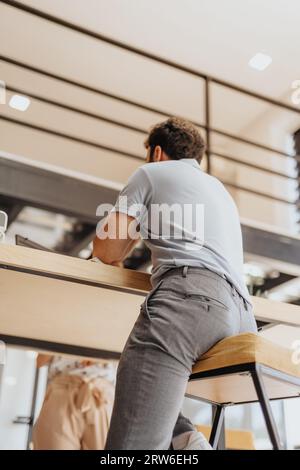 In a corporate office, businessman collaborate on business ideas, analyze data, and work together for better results. Efficient teamwork drives growth Stock Photo