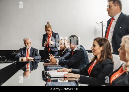 Business Executives Strategizing for Profit Growth and Better Efficiency Stock Photo