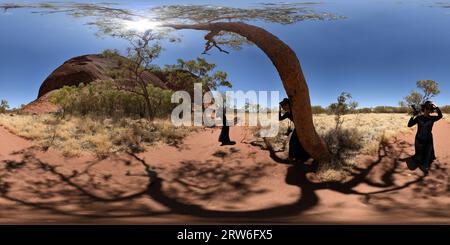 360 degree panoramic view of 360° Panorama - A Woman on Kuniya Walk Uluru, Northern Territory, Outback Australia.