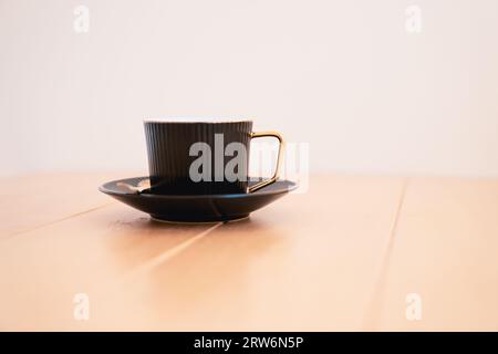 Cup of hot coffee on the wooden table. Stock Photo