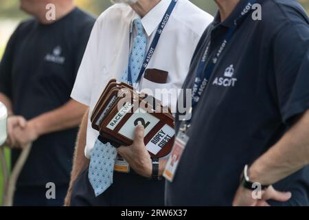 Ascot, Berkshire, UK. 9th September, 2023. Stewards collect the groom armbands before the Bet365 Handicap Stakes. Credit: Maureen McLean/Alamy Stock Photo