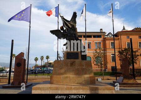 Ajaccio, France - August 01, 2023 : - bronze statue in honor of the fallen patriots located behind town hall . Inscription in French : Corsica to its Stock Photo