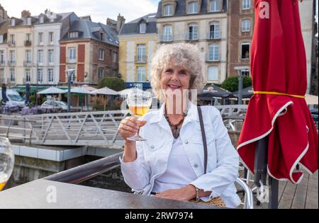 Enjoying a drink on the quayside in Dieppe , Normandy  Dieppe is a fishing port on the Normandy coast of northern France    Credit Simon Dack Stock Photo