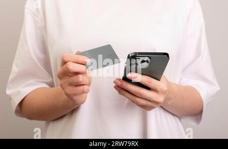 Berlin, Germany September 16 2023 Online payment with smartphone and bank card Stock Photo