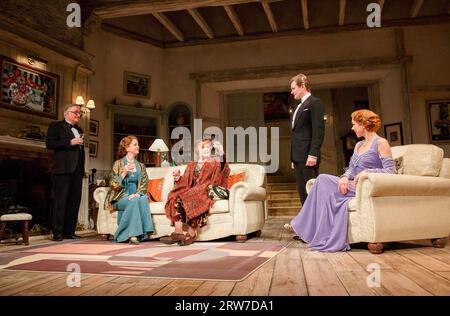 l-r: Simon Jones (Dr Bradman), Serena Evans (Mrs Bradman), Angela Lansbury (Madame Arcati), Charles Edwards (Charles Condomine), Janie Dee (Ruth Condomine) in BLITHE SPIRIT by Noel Coward at the Gielgud Theatre, London W1  18/03/2014  design: Simon Higlett  lighting: Mark Jonathan  director: Michael Blakemore Stock Photo