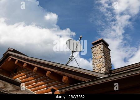 A satellite dish on the roof of Lolo Pass Visitor Center, Lolo Pass, Idaho. Stock Photo