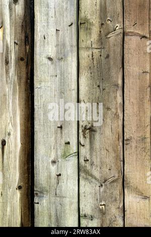 Fragment of old boards on a wooden building. Stock Photo
