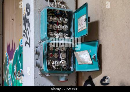 Vandalized distribution board inside abandoned industrial building in Paimio, Finland Stock Photo