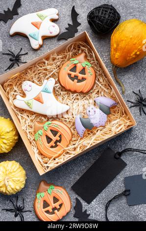 Multicolored Halloween  homemade cookies in a gift box on dark background. Stock Photo